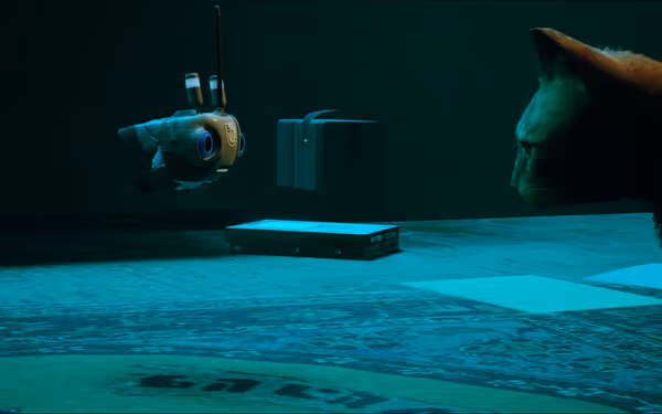 A robotic drone and a cat face each other under blue lighting on a patterned rug.